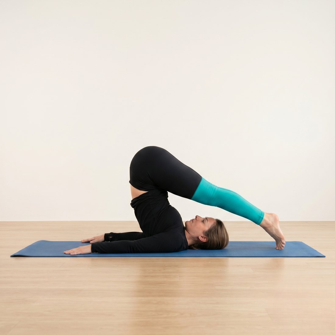 Michelle demonstrating Plough Pose (Halasana)