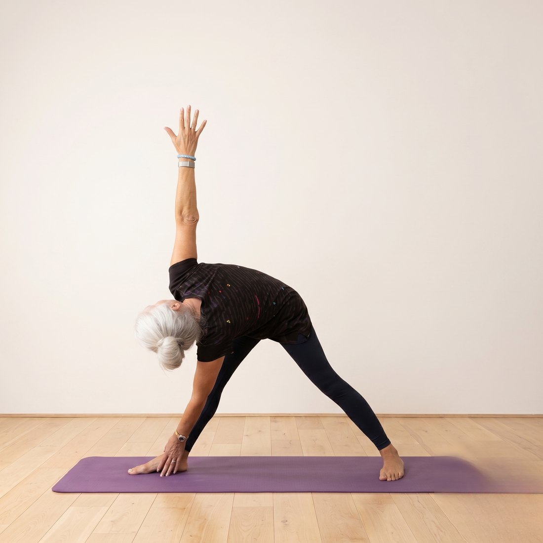 Michelle demonstrating Revolved Triangle (Parivrtta Trikonasana)