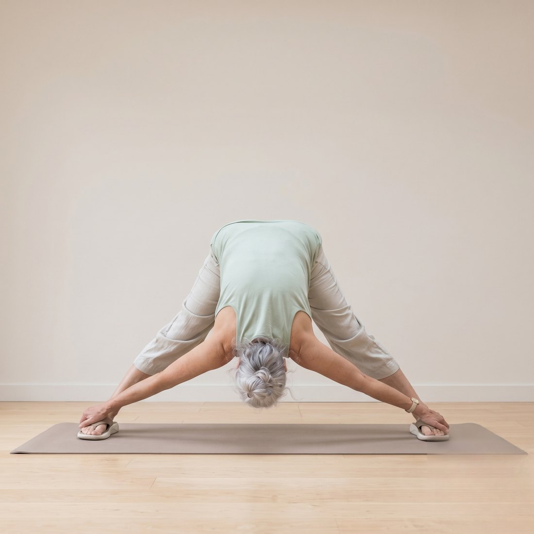 Michelle demonstrating Wide-Legged Forward Fold